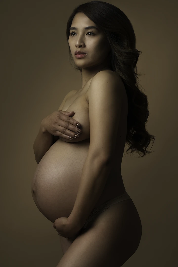 pregnant woman holding belly - Calgary maternity photography - studio 342